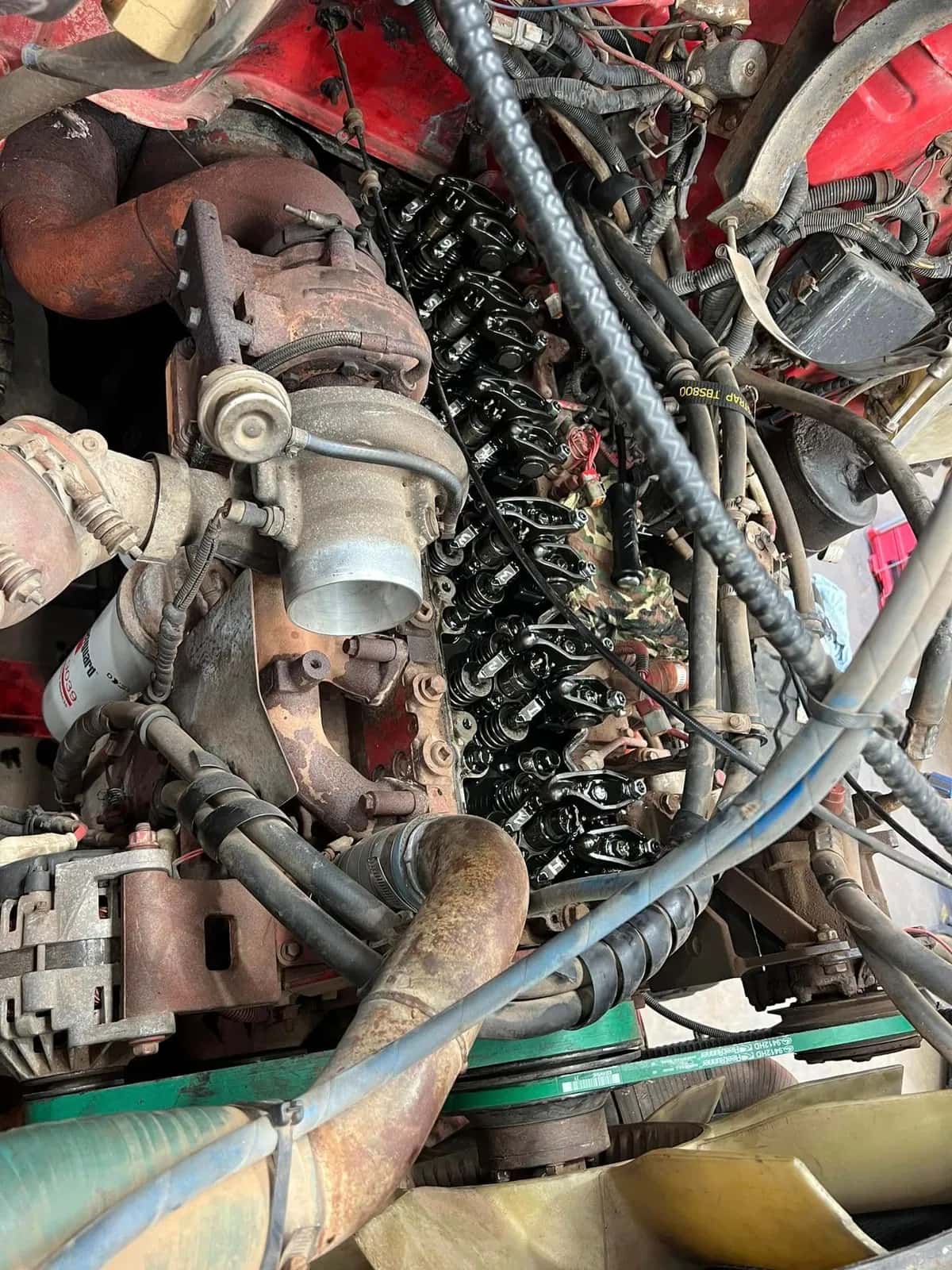The same style of engine with the rocker gear exposed and new gaskets ready to fit.